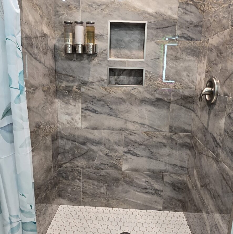 View of marble and tile private shower in Suite 3 at the London Guest House