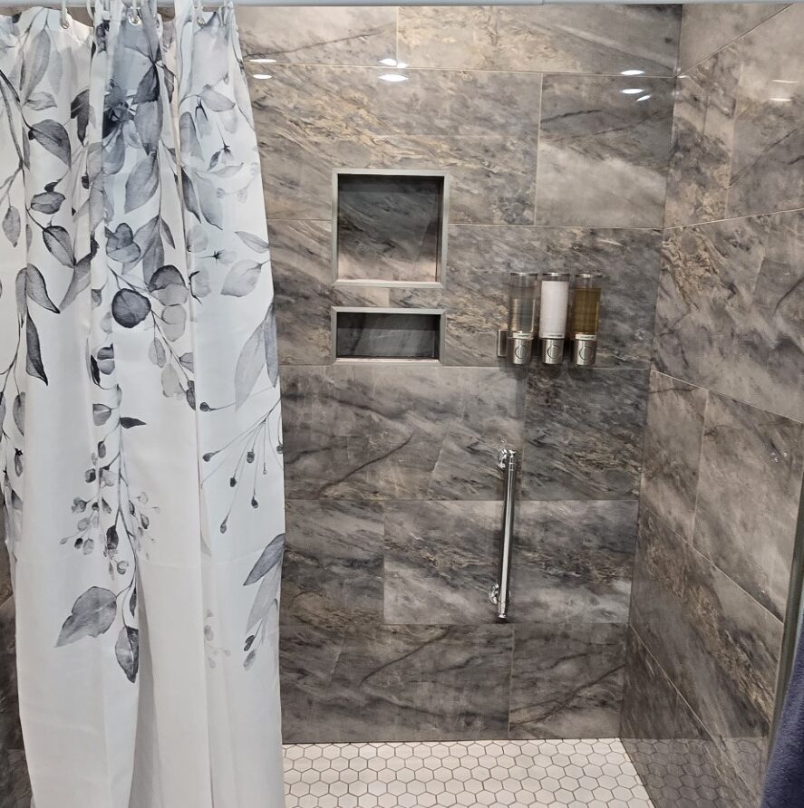 Tall view of the marble step-in shower in the private bathroom for Suite 4 at the London Guest House