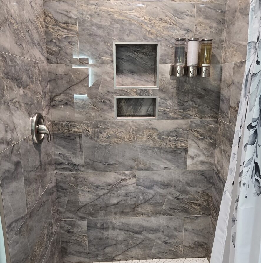 View of private marble and tile shower in Suite 2 at the London Guest House